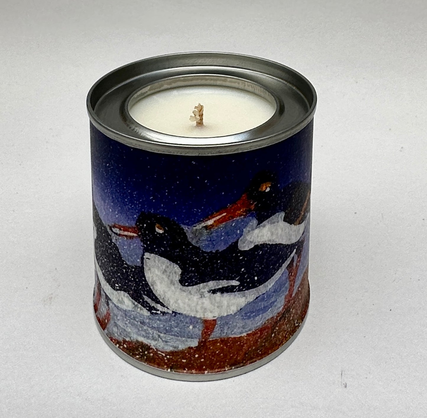 Small candle in a tin/Five Oystercatchers standing on the shoreline