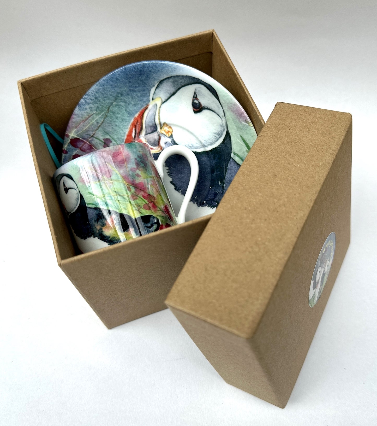 expresso set printed with a watercolour painting of two puffins in a cardboard box with lid