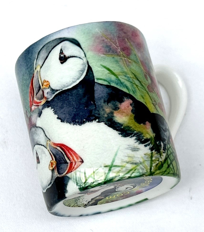 expresso cup with a painting of orkney puffins