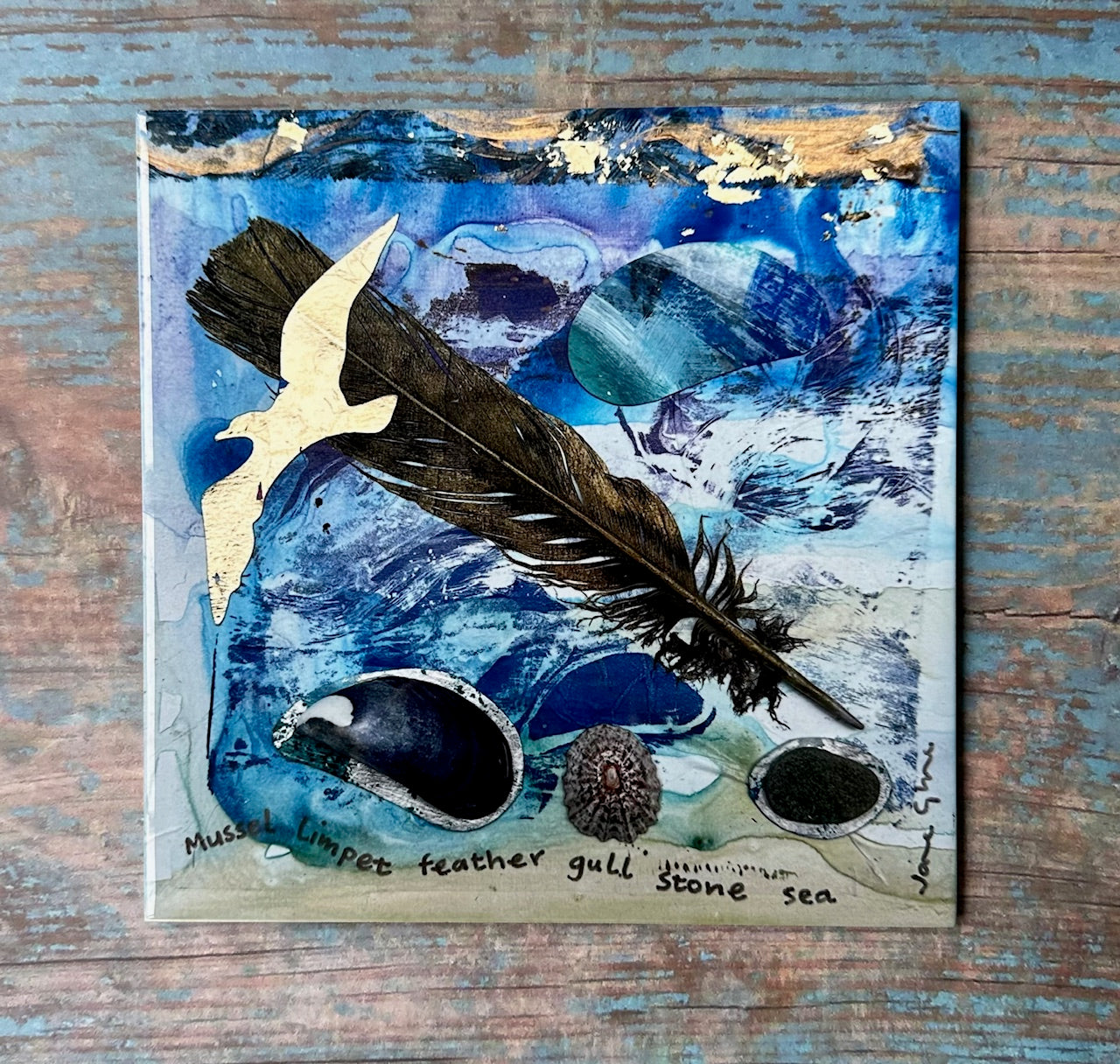 Large ceramic tile/Mussel Limpet feather gull stone sea