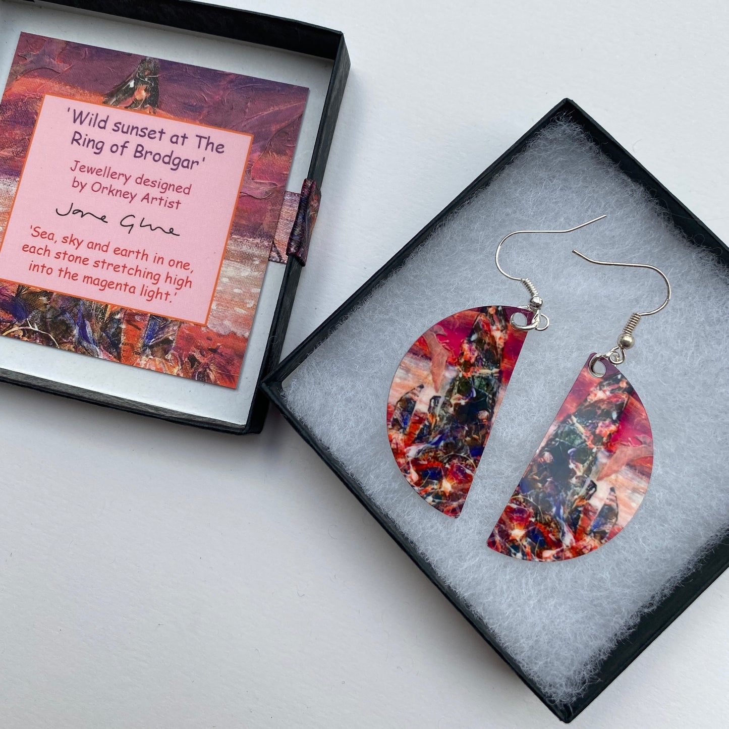 A pair of earrings design Wild sunset at The Ring of Brodgar by Orkney artist Jane Glue, Scotland