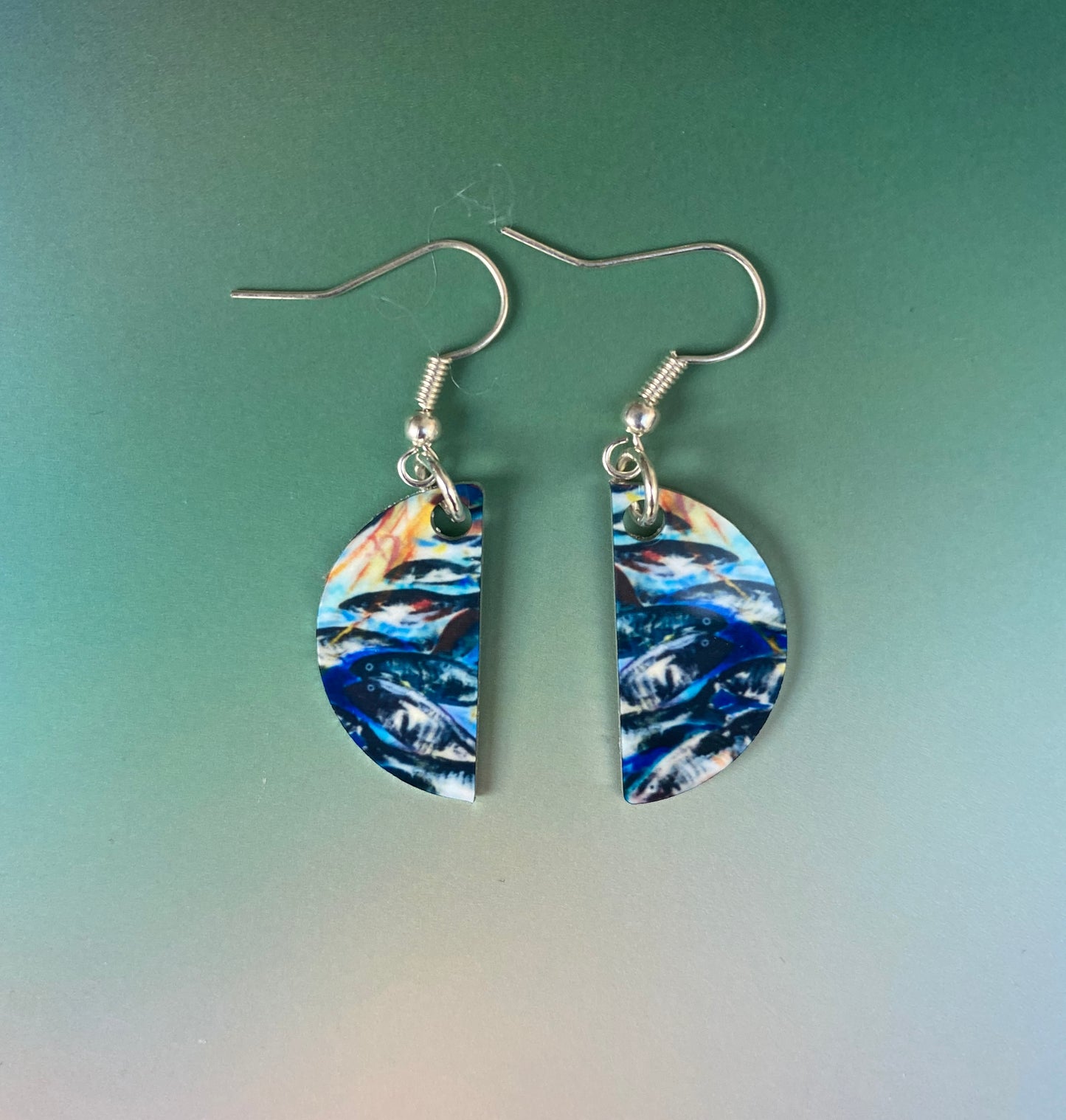 A pair of earrings, Silver Darlings designed by Orkney artist Jane Glue, Scotland