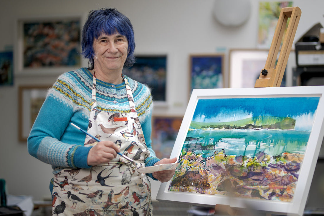 A picture of Orkney artist Jane Glue standing in front of her painting, 'Blackbirds and old bus, Hoy' which was exhibited at the annual exhibition of art at The gallery of art, The mound, Edinburgh in 2014.'