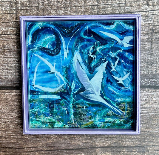 Glass coaster/Terns diving in the early morning