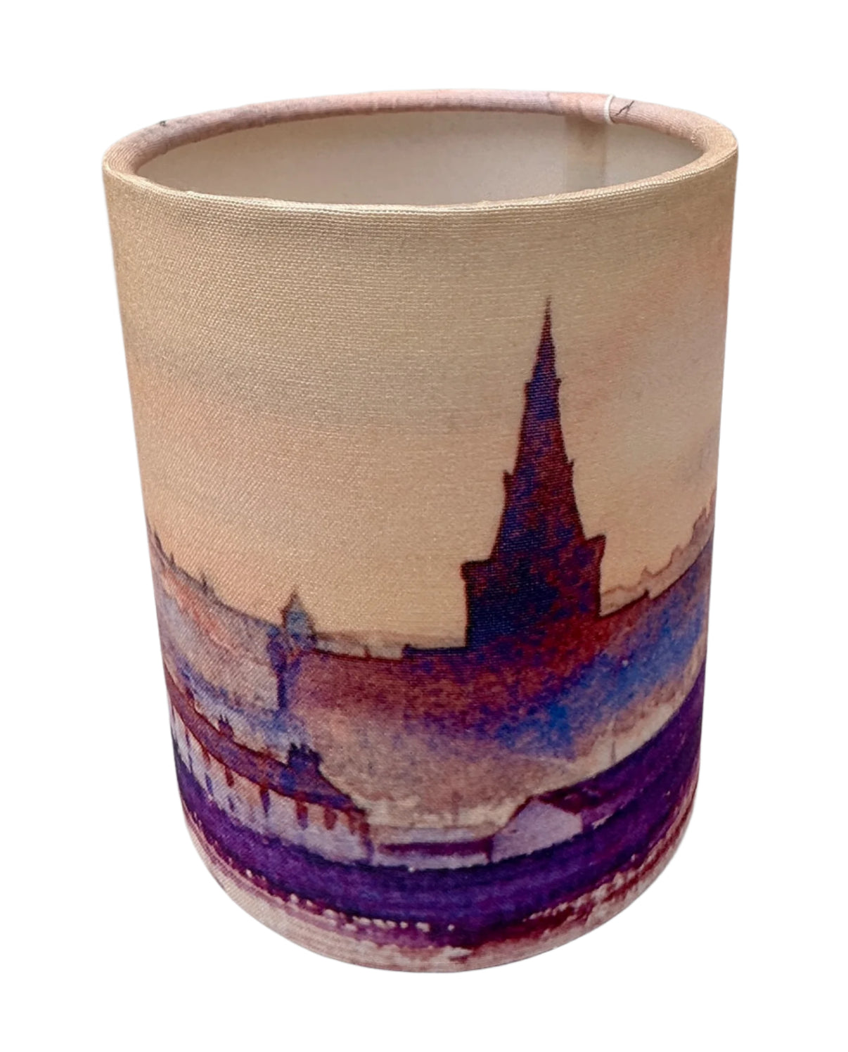 A Small candle lamp with an image of a Sunset over Kirkwall bay www