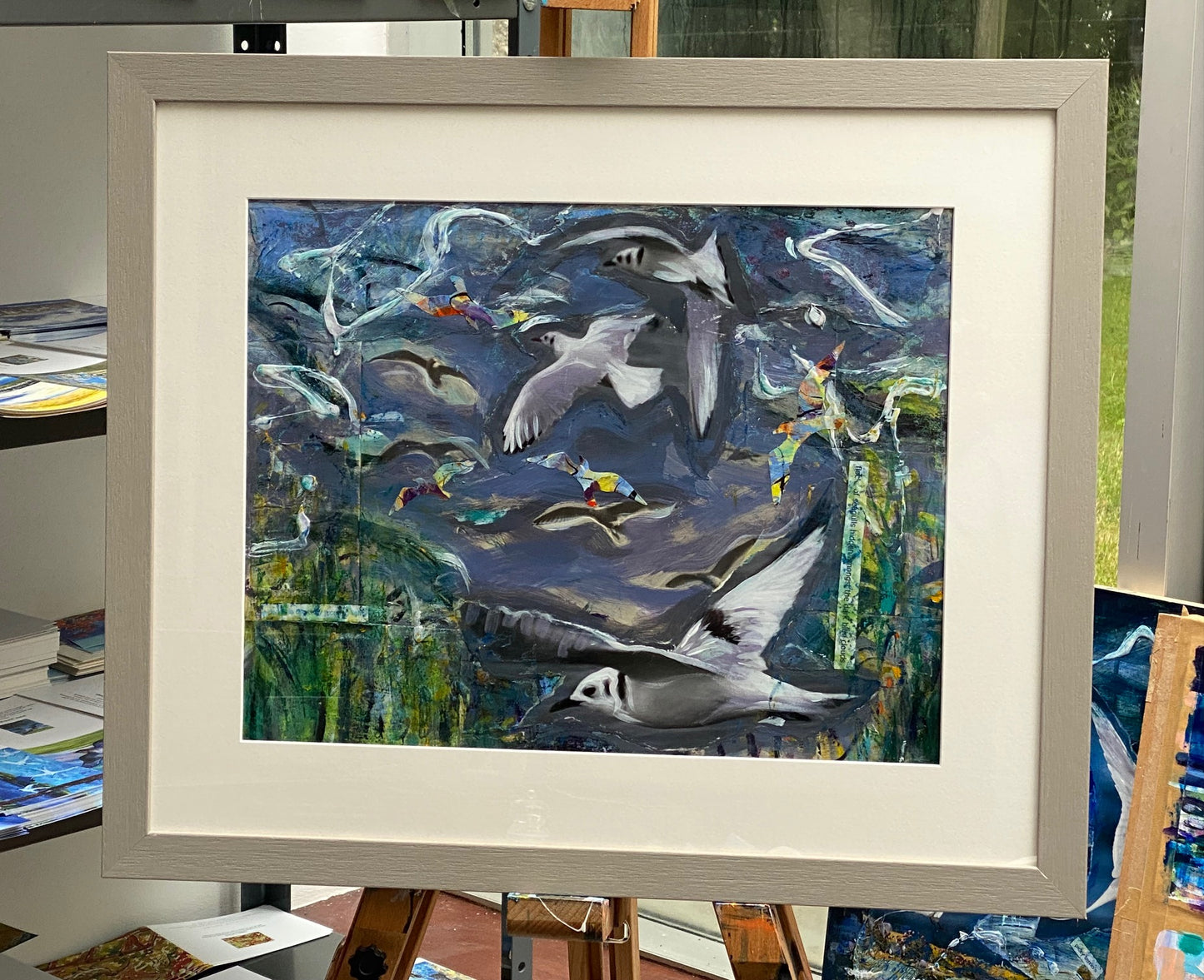 Original painting framed/Flock of seagulls hidden amongst the dark blue clouds