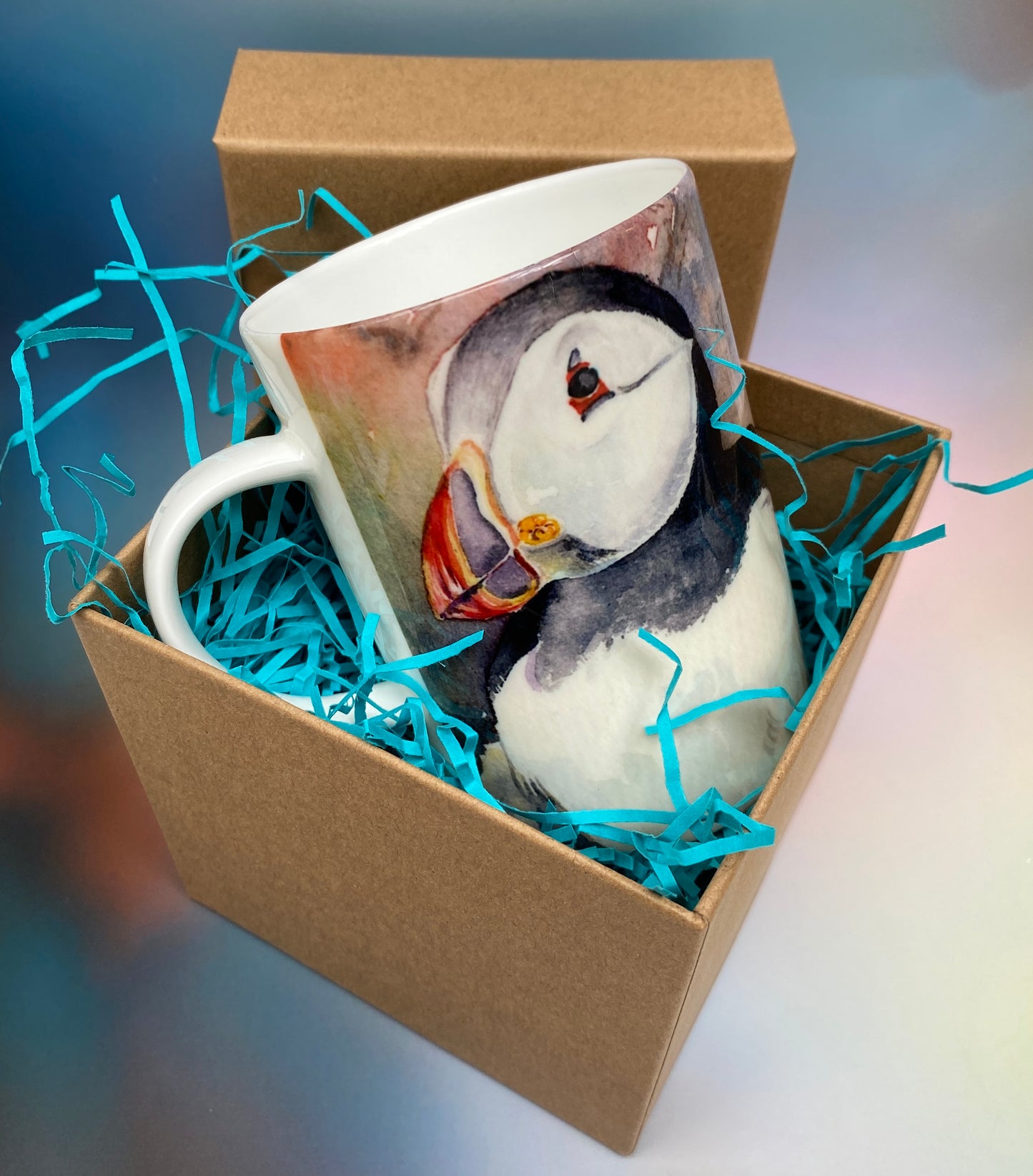 A mug with a puffins design by Orkney artist Jane Glue, Scotland