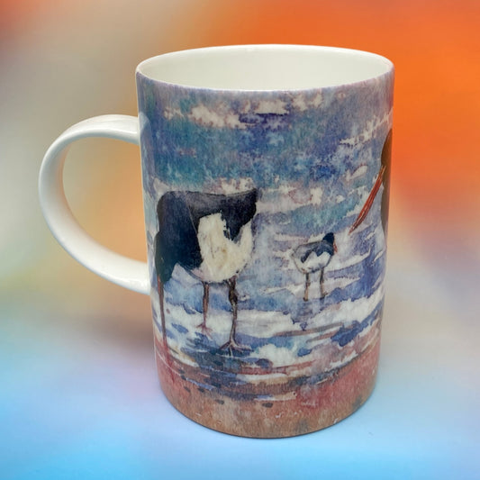 A mug with a oystercathers design by Orkney artist Jane Glue, Scotland