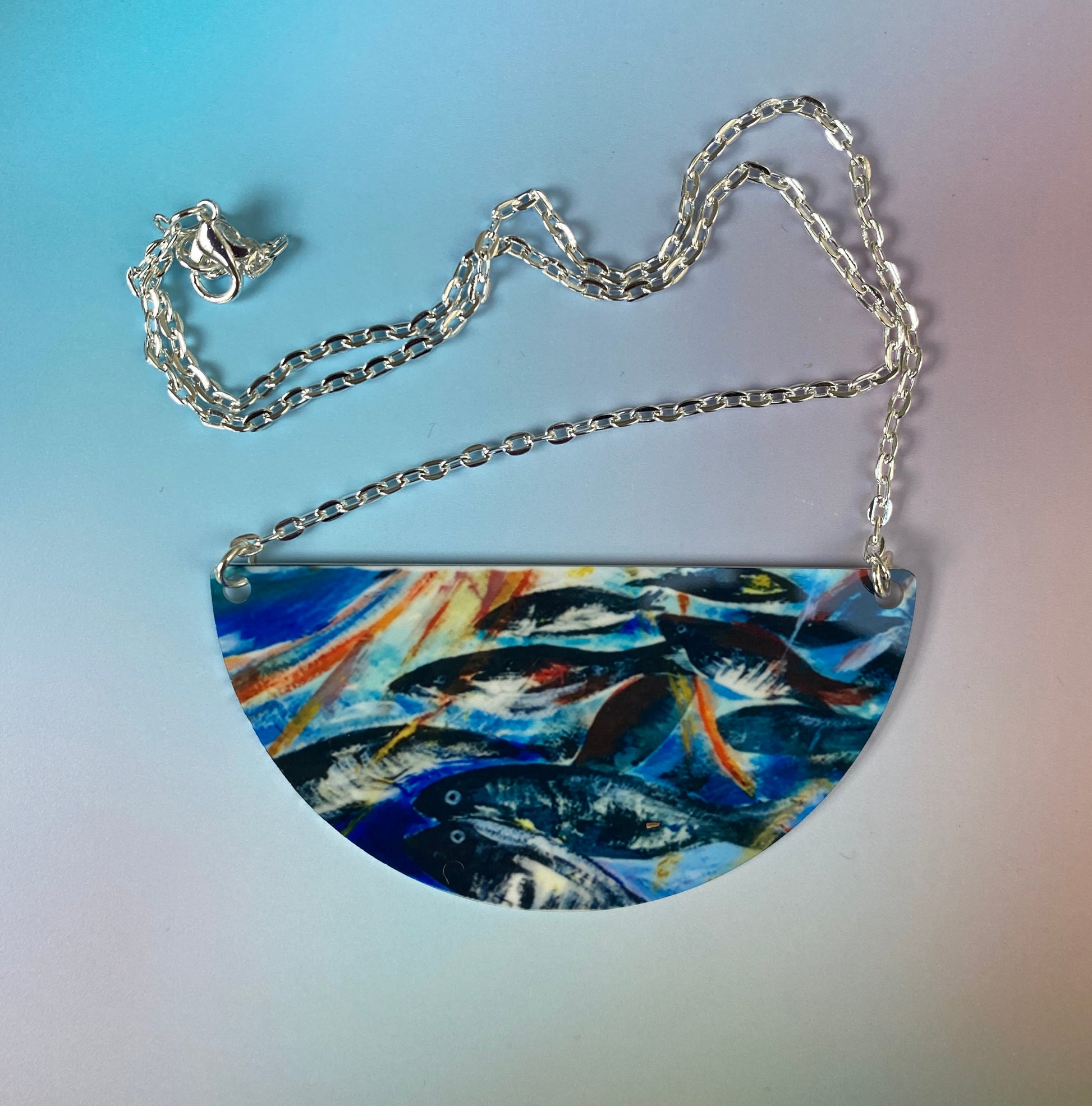 A necklace with Silver darlings design by Orkney artist Jane Glue, Scotland