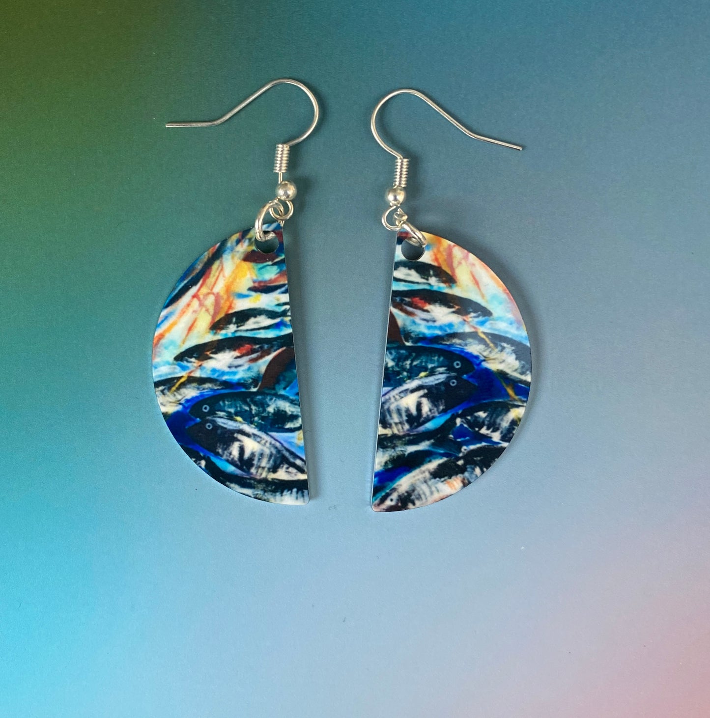 A pair of earrings design Silver darlings by Orkney artist Jane Glue, Scotland