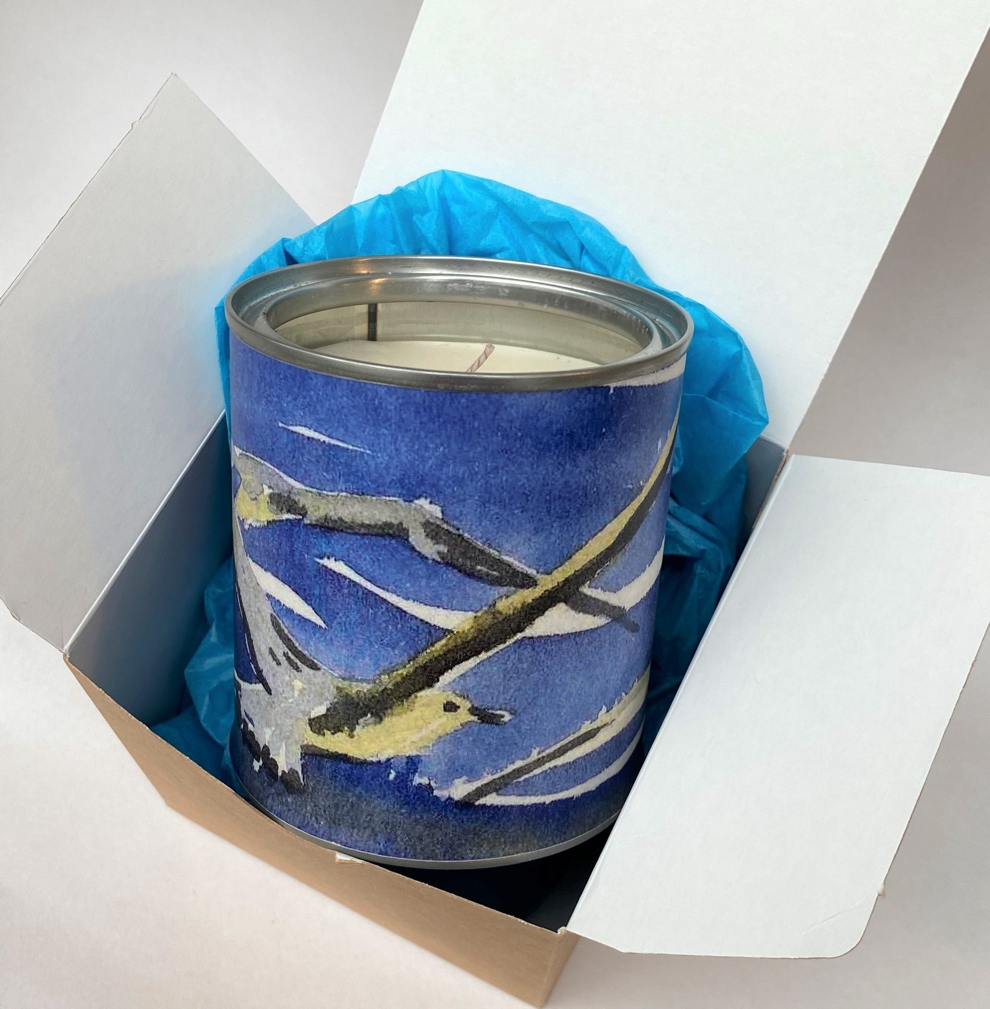 handmade candle tin with a watercolour picture of gulls